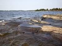 Oever van het Vanernmeer  Rocky bank of Lake Vanern, Säffle, Dalsland, Sweden : Lake Vanern, Saffle Dalsland, lake, rural landscape, summer, water, wave, bank, Europe, European, natural, nature, rock, rocky, Scandinavia, Scandinavian, shore, summertime, Sweden, Swedish, Vanern