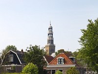 View along canal in historic Dutch city Hindeloopen  View along canal in historic Dutch city Hindeloopen : Hindeloopen, Hylpen, Friesland, Dutch, Netherlands, Holland, Europe, European, Fryslan, town, city, cityscape, house, houses, building, buildings, nobody, no people, travel, travel destination, destination, tourism, canal, water, tower, history, the past, historic, tree, trees, urban landscape, landscape, urban, view, boat, rowing boat