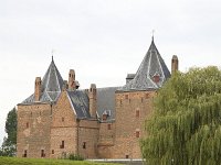 NL, Gelderland, Zaltbommel, Slot Loevestein 2, Saxifraga-Roel Meijer  "Slot Loevestein, a castle that plays an important role in the history of Holland : architecture, Brakel Gelderland, castle castles, castle-moat, castle-moat moats, color, colour, Dutch, Europe European, historic building, Holland, important monument, landmark, Netherlands, rural landscape, Slot Loevestein, tower, vertical, water, "Hugo de Groot", defend defending defence