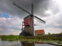 Old wooden windmill  Old wooden windmill in a polder environment : Kaag en Braassem, Netherlands, Polder, Rijpwetering, Zuid Holland, agricultural, agriculture, boezem, boezempeil, canal, channel, ditch, dreigende, dutch, environment, field, gele plomp, green, historic, historisch, historische, holland, hout, houten, kanaal, koe, koeien, landscape, landschap, lelie, lucht, management, mill, mills, molen, molens, natuur, nederland, old, open, oud, river, rudmer zwerver, rural, sling, slinger, sloot, south, summer, vaart, vintage, water, waterkwaliteit, waterschap, wind, windmill, windmolen, zomer, zuid