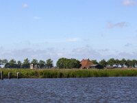 Typical landscape with lakes of Dutch province Friesland  Typical landscape with lakes of Dutch province Friesland : sky, skyscape, cloud, clouds, cloudscape, outside, outdoor, landscape, rural landscape, countryside, rural scene, non-urban scene, lake, water, land, Friesland, Frylan, Dutch, Holland, Netherlands, Europe, European, no people, nobody, summer, summertime, spring, springtime, room, recreation, reed, relaxationfarm, farmland, waves, horizon, horizon over land