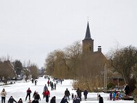 Ice skating on canal  In Bleskensgraaf, South Holland, Netherlands : Dutch, Europe, European, Holland, Netherlands, canal, cold, ice skating, icy, outdoors, outside, recreation, skate, skater, sport, white, winter, Dutch tradition, Hobby, Sports, freeze, freezing, frost, snow, snowy
