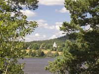 Frykerud, Zweden  Swedish village Frykerud shot across lake, Varmland, Sweden : church, building, countryside, lake, rural, rural landscape, summer, water, Europe, European, forest, Frykerud, kirke, natural, nature, Scandinavia, Scandinavian, summertime, Sweden, Swedish, village, woodland