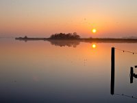 Sunset and bollard  Sunset and bollard are reflecting in water during sunset : Noordenveld, atmosphere, autumn, calm, creative nature, dageraad, dawn, dusk, dutch, geel, hemel, herfst, holland, kalm, lake, lakeside, landscape, landschap, leekstermeer, lente, licht, light, meer, mist, natura 2000, natural, nature, natuur, natuurlijke, nederland, nederlands, nevel, nevelig, orange, oranje, peace, quiet, reflect, reflecteren, reflectie, reflection, rudmer zwerver, rust, schemering, sereen, serene, sfeer, silhouette, sky, spectaculair, spectacular, spring, summer, sun, sunbeam, sunlight, sunray, sunrise, sunset, sunshine, tranquil, twilight, vredig, water, yellow, zomer, zon, zonlicht, zonneschijn, zonnestraal, zonsondergang, zonsopgang