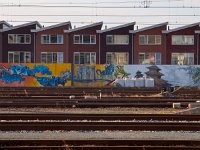 railroad with modern houses backdrop  railroad with modern houses backdrop : architecture, architectuur, backdrop, building, city, cityscape, commuter, creative nature, dutch, europe, graffiti, holland, home, houses, huis, huizen, huizenmarkt, journey, landscape, landschap, leeuwarden, locomotive, modern, motion, nederland, nieuw, nieuwbouw, railroads, rails, railway, red, residence, rudmer zwerver, sky, speed, spoor, spoorweg, stad, stadsbeeld, station, steel, street, technology, tracks, train, transport, transportation, with, woning, woningen, woningmarkt, zomer