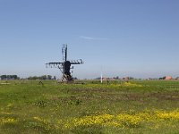 Typical rural landscape of Dutch province Friesland  Typical rural landscape of Dutch province Friesland : sky, outside, outdoor, landscape, rural landscape, countryside, rural scene, non-urban scene, land, Friesland, Frylan, Dutch, Holland, Netherlands, Europe, European, no people, nobody, summer, summertime, spring, springtime, farm, farmland, agriculture, agricultural, grass, grassland, meadow, plain, room, blue, windmill, mill, dutch culture, architecture, building, horizon, horizon over land