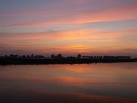 Sunset over lake in Dutch province Friesland  Sunset over lake in Dutch province Friesland : sunset, evening, dusk, twilight, setting sun, red, warm, sky, skyscape, cloud, clouds, cloudscape, reflection, reflected, mirror, mirrored, outside, outdoor, landscape, rural landscape, countryside, rural scene, non-urban scene, lake, water, land, Friesland, Frylan, Dutch, Holland, Netherlands, Europe, European, no people, nobody, summer, summertime, spring, springtime, romantic