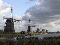 Five Dutch windmills of World Heritage Site Kinderdijk, Netherlands  Five Dutch windmills of World Heritage Site Kinderdijk, Netherlands : Kinderdijk, Alblasserwaard, South Holland, Netherlands, Holland, windmill, windmills, Unesco world heritage site, world heritage site, rural landscape, landscape, rural, nobody, no people, nature, natural, countryside, summer, summertime, fall, autumn, architecture, monument, landmark, old, travel, travel destination, destination, tourism, rural scene, non-urban scene, sail, sails, cloud, clouds, cloudscape, famous, canal, water, five, 5, row, in a row, building, 18th century