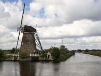 Dutch windmills of World Heritage Site Kinderdijk, Netherlands  Dutch windmills of World Heritage Site Kinderdijk, Netherlands : Kinderdijk, Netherlands, Holland, windmill, windmills, Unesco world heritage site, world heritage site, rural landscape, landscape, rural, nobody, no people, nature, natural, countryside, summer, summertime, fall, autumn, architecture, monument, landmark, old, travel, travel destination, destination, tourism, rural scene, non-urban scene, sail, sails, cloud, clouds, cloudscape, famous, canal, water, building, 18th century, Alblasserwaard, South Holland, skyscape