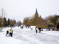 Ice skaters on Dutch canal, Bleskensgraaf, South Holland, Nether  Ice skaters on Dutch canal, Bleskensgraaf, South Holland, Netherlands : Dutch, Europe, European, Holland, Netherlands, canal, ice skating, outdoors, outside, recreation, skate, skater, sport, white, winter, icy, freeze, freezing, frost, snow, snowy, wintersport, wintertime