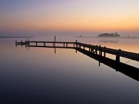 Bent jetty with mooring post  Bent jetty with mooring post during spectacular sunset over lake : Noordenveld, aanlegsteiger, afmeren, atmosphere, autumn, bent, bollard, calm, creative nature, dageraad, dawn, dusk, dutch, gebogen, geel, herfst, holland, hoogtezon, houten, jetty, kalm, lake, lakeside, landing stage, landscape, landschap, leek, leekstermeer, lente, licht, light, lucht, matsloot, meer, mist, mooring, natural, nature, natuur, natuurlijk, nederland, nederlands, orange, oranje, paal, peace, pier, post, quiet, reflect, reflecteren, reflectie, reflection, rudmer zwerver, rustig, sandebuur, schemering, sereen, serene, sfeer, sky, spectaculaire, spectacular, spring, steiger, summer, sun, sunbeam, sunlight, sunray, sunrise, sunset, sunshine, tranquil, twilight, vredig, water, windstil, wooden, yellow, zomer, zon, zonlicht, zonneschijn, zonnestraal, zonsondergang, zonsopgang