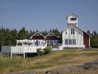 Vuurtoren aan het Vanernmeer  Former lighthouse, now restaurant on the bank of Lake Vanern, Säffle, Dalsland, Sweden : bank shore, color, colour, Europe European, horizontal, lake, Lake Vanern, lighthouse, Midsummer tree, nature natural, restaurant, rock rocky, rural landscape, Saffle Dalsland, Scandinavia Scandinavian, summer, Sweden Swedish, water