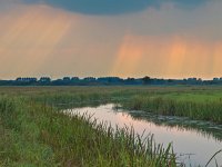 Sunrays are shining through the clouds  Sunrays are shining through the clouds above lowland river valley : Ald djip, Beetsterzwaag, Koningsdiep, Nature Conservation Policy, Netherlands, Opsterland, Van Oordt Mersken, Van Oordts Mersken, atmosphere, beek, beekdal, biotoop, bovenloop, cloud, clouds, cloudy sky, creative nature, creek, dramatic, environment, flow, friesland, green, groen, habitat, holland, landscape, landschap, licht, light, middenloop, middle stretch, natura 2000, natural, naturally, nature, nature conservation, natuur, natuurbeheer, natuurbeleid, natuurlijk, natuurlijke, natuurwet, nederland, omgeving, onweer, orange, oranje, pink, rain, ray, rays, regen, river, river valley, rivier, rivierdal, roze, rudmer zwerver, sky, storm, storms, straal, stream, stroom, summer, sun, sunbeam, sunrays, upstream, water, wolk, wolken, wolkenlucht, zomer, zon, zonnestraal