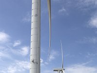 Row of windturbines in south-western part of Dutch province Frie  Row of windturbines in south-western part of Dutch province Friesland : constructio, durability, durable energy, energy, Europe, European, Friesland, Dutch, Fryslan, green energy, Holland, Netherlands, wind, wind power, windfarm, windturbine, windturbines, blue sky, no people, nobody, outdoors, outside, white clouds, in a row, row