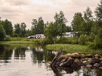 Swedish camp site along a lake  Lake Ovre Brocken, near Torsby, Värmland, Sweden : lake, Ovre Brocken, rural landscape, Scandinavia Scandinavian, summer, water, boulder, camp site, camping, caravan, dam, Europe, European, natural, nature, rock, rocky, Sweden, Swedish, tent, Torsby, Varmland