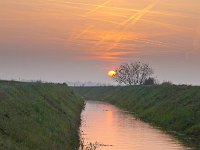 Contrails over rural landscape  Contrails turn orange during sunset over dutch ditch : Netherlands, airplane, airspace, architecture, architectuur, atmosphere, avond, blauw, blue, boom, bouw, canal, condensatie spoor, condensation trail, condensstreep, congested, construction, contrail, crane, creative nature, crossing, crowded, dageraad, damp spoor, dawn, ditch, dramatic, dramatisch, druk, dusk, evening, field, geel, gras, grass, green, groen, groningen, holland, jet trail, kanaal, kraan, kruising, landelijk, landscape, landschap, lucht, luchtruim, main, nederland, onstwedde, orange, oranje, plane trail, pollution, red, river, rivier, rood, rook, rudmer zwerver, rural, schemering, sfeer, sky, sloot, smoke, spoor, summer, sunrise, sunset, traffic, vapor trail, veld, verkeer, verstopte, vervuiling, vliegtuig, vliegtuig spoor, voornaamste, water, yellow, zomer, zonsondergang, zonsopgang