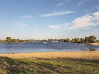 Dutch river Meuse near Well, Gelderland, Netherlands  Dutch river Meuse near Well, Gelderland, Netherlands : afgedamde maas, autumn, autumnal, beach, blue sky, Europe, European, fall, gelderland, Holland, meuse, Netherlands, no people, nobody, non-urban scene, river, riverscape, rural, rural landscape, rural scene, scenic, skyscape, stream, water, well