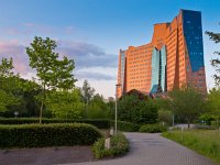 Organic style office  Organic style office building seen from the side during sunset : Anthroposophy, Gasunie, anthroposophical, antroposofie, antroposofisch, architecture, architectuur, blauw, blue, building, buildings, city, concrete, cool, creatief, creative nature, design, dutch, enonomie, entrance, entree, european, federal office, field, finance, financial, financieel, financiën, gas, gas industry, gebouw, gebouwen, glas, glass, glass windows, glazen, gras, grass, green, grey, grijs, groen, groningen, head, head office, headquarters, holland, hoofd, hoofdkantoor, kantoor, kantoren, landmark, landscape, landschap, modern, mood, natural, natuurlijk, nederland, niemand, nobody, odd, office, offices, oil industry, ontwerp, organic, organisch, oriëntatiepunt, ramen, red, reflectie, reflection, rood, rudmer zwerver, rudolf steiner, stad, stedelijke, stijl, strange, structure, structuur, style, surreal, surreeel, urban, vreemd, windows, yellow