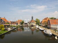 Cityscape of Dutch historical city Hindeloopen  Cityscape of Dutch historical city Hindeloopen : Hindeloopen, Hylpen, Friesland, Dutch, Netherlands, Holland, Europe, European, Fryslan, town, city, cityscape, house, houses, building, buildings, nobody, no people, travel, travel destination, destination, tourism, canal, water, tower, history, the past, historic