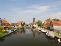 Cityscape of Dutch historical city Hindeloopen  Cityscape of Dutch historical city Hindeloopen : Hindeloopen, Hylpen, Friesland, Dutch, Netherlands, Holland, Europe, European, Fryslan, town, city, cityscape, house, houses, building, buildings, nobody, no people, travel, travel destination, destination, tourism, canal, water, tower, history, the past, historic