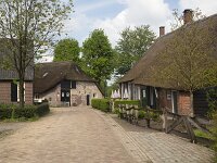 Farmhouses in historic rural settlement Giersbergen, North Brabant, Netherlands  Farmhouses in historic rural settlement Giersbergen, North Brabant, Netherlands : farm, farmhoues, historic, history, old, monument, dutch culture, village, sttlement, building, countryside, rural, landscape, rural landscape, rural scene, non-urban landscape, non-urban scene, outside, outdoor, outdoors, no people, nobody, season, summer, summertime, Giersbergen, Drunen, North Brabant, Netherlands, europe, european