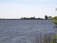 Typical landscape with lakes of Dutch province Friesland  Typical landscape with lakes of Dutch province Friesland : sky, skyscape, cloud, clouds, cloudscape, outside, outdoor, landscape, rural landscape, countryside, rural scene, non-urban scene, lake, water, land, Friesland, Frylan, Dutch, Holland, Netherlands, Europe, European, no people, nobody, summer, summertime, spring, springtime, room, recreation, reed, relaxationfarm, farmland, waves, horizon, horizon over land