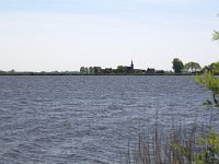 Typical landscape with lakes of Dutch province Friesland  Typical landscape with lakes of Dutch province Friesland : sky, skyscape, cloud, clouds, cloudscape, outside, outdoor, landscape, rural landscape, countryside, rural scene, non-urban scene, lake, water, land, Friesland, Frylan, Dutch, Holland, Netherlands, Europe, European, no people, nobody, summer, summertime, spring, springtime, room, recreation, reed, relaxationfarm, farmland, waves, horizon, horizon over land