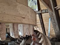 Wooden gear wheel of historic windmill Doris Mooltsje, Oudega, Sudwest-Fryslan, Friesland, Netherlands  Wooden gear wheel of historic windmill Doris Mooltsje, Oudega, Sudwest-Fryslan, Friesland, Netherlands : windmill, Doris Mooltsje, Oudega, Aldegea, Sudwest-Fryslan, Friesland, Netherlands, Dutch, europe, european, monument, historic, history, culture, dutch culture, travel destination, destination, no people, nobody, gear, gear wheel, cog wheel, cog, wood, wooden, mechanism