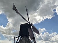 Historic windmill Doris Mooltsje, Oudega, Sudwest-Fryslan, Friesland, Netherlands  Historic windmill Doris Mooltsje, Oudega, Sudwest-Fryslan, Friesland, Netherlands : windmill, Doris Mooltsje, Oudega, Aldegea, Sudwest-Fryslan, Friesland, Netherlands, Dutch, europe, european, building, architecture, monument, historic, history, culture, dutch culture, travel destination, destination, black, 4, four, wings, rural, landscape, rural landscape, outside, outdoor, outdoors, no people, nobody, season, summer, summertime, sky, blue sky, white clouds, grass
