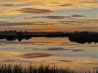 Sunset with red colored sky, mirrored in water; Smallingerland, Friesland, Netherlands  Sunset with red colored sky, mirrored in water; Smallingerland, Friesland, Netherlands : sunset, setting sun, sun, evening, sundown, red, skyscape, color, colored, coloured, colour, reflect, reflecting, mirror, mirroring, dusk, horizon, water, cloud, clouds, cloudy, beauty, beautiful, romantic, blue, outdoor, summer, summertime, no people, nobody, silhouette, silhouetting, reflected, mirrored, nature, outdoors, outside, natural, landscape, rural, rural landscape, countryside, rural scene, scenic, non-urban landscape, non-urban scene, lake, pool, quiet scene, De Veenhoop, Smallingerland, Friesland, Fryslan, Neterlands, Dutch, Europe