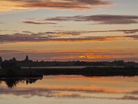 Sunset with red colored sky, mirrored in water; Smallingerland, Friesland, Netherlands  Sunset with red colored sky, mirrored in water; Smallingerland, Friesland, Netherlands : sunset, setting sun, sun, evening, sundown, red, skyscape, color, colored, coloured, colour, reflect, reflecting, mirror, mirroring, dusk, horizon, water, cloud, clouds, cloudy, beauty, beautiful, romantic, blue, outdoor, summer, summertime, no people, nobody, silhouette, silhouetting, reflected, mirrored, nature, outdoors, outside, natural, landscape, rural, rural landscape, countryside, rural scene, scenic, non-urban landscape, non-urban scene, lake, pool, quiet scene, De Veenhoop, Smallingerland, Friesland, Fryslan, Neterlands, Dutch, Europe