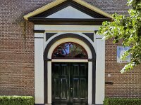 Entrance of the historic church of Dutch village Elahuizen, Friesland, Netherlands  Entrance of the historic church of Dutch village Elahuizen, Friesland, Netherlands : entrance, door, wooden, green, white, yellow, gable, historic, church, monument, building, architecture, 19th century, religion, religious, landmark, Balk, friesland, fryslan, netherlands, holland, dutch, europe, no people, nobody, summer, summertime, de fryske marren, de friese meren