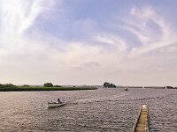 View of Dutch lake Sneekermeer; Friesland, Netherlands  View of Dutch lake Sneekermeer; Friesland, Netherlands : sneekermeer, lake, water, rural, landscape, rural landscape, rural scene, non-urban landscape, non-urban scene, outside, oudoor, outdoors, summer, summertime, open wide, room, flat, watersports, sky, skyscape
