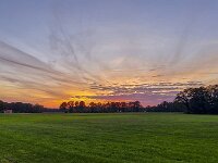 Sunset over rural landscape of eastern part of Dutch province Gelderland  Sunset over rural landscape of eastern part of Dutch province Gelderland : Winterswijk, Achterhoek Gelderland, Netherlands, Dutch, Holland, nature, natural, farm, farmland, grass, grassy, grassland, field, tree, trees, rural landscape, landscape, rural scene, non-urban landscape, non-urban scene, outside, outdoor, outdoors, no people, nobody, summer, summertime, cloud, clouds, cloudy, sky, skyscape, sunset, evening, twilight, red, orange