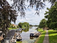 View on Dutch river Alblas; Alblasserdam, South Holland, Netherlands  View on Dutch river Alblas; Alblasserdam, South Holland, Netherlands : view, river, Alblas, water, ship, ships, boat, boats, rowing boat, tree, trees, foliage, blue sky, sky, clouded sky, clouds, scenic, rural, landscape, rural landscape, rural scene, non-urban landscape, non-urban scene, outside, outdoor, outdoors, no people, nobody, season, summer, summertime, Alblasserdam, South Holland, Netherlands, Dutch, Holland, Europe, European