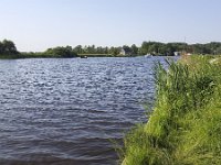 Dutch lake  Dutch lake : Dutch, europe, european, Friesland, frisian, green, Holland, lake, natural, nature, Netherlands, reed, rural landscape, rural scene, summer, summertime, tranquil scene, tranquillity, water, boat, dinghy, grass, houseboat