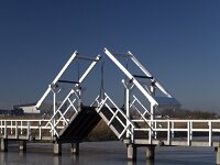 NL, Zuid-Holland, Molenlanden, Kinderdijk 5, Saxifraga-Roel Meijer  Bridge is open and mirrored on ice of canal. : No entrance, Travel destinations, Winter, Wintertime, Dutch culture, blue sky, bridge, canal, double, draw bridge, ice, kinderdijk, mirrored, reflected, reflection, unesco, white, wooden bridge, world heritage site