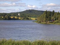 Frykerud, Zweden  Swedish village Frykerud shot across lake, Varmland, Sweden : building, church, countryside, lake, rural, rural landscape, summer, water, Europe, European, forest, Frykerud, kirke, natural, nature, Scandinavia, Scandinavian, summertime, Sweden, Swedish, village, woodland